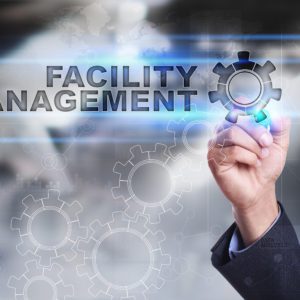 Businessman is drawing on virtual screen. facility management concept